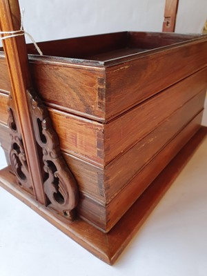 Lot 253 - A CHINESE WOOD TIERED PICNIC BOX.