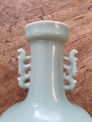 Lot 558 - A PAIR OF CHINESE CELADON-GLAZED VASES.