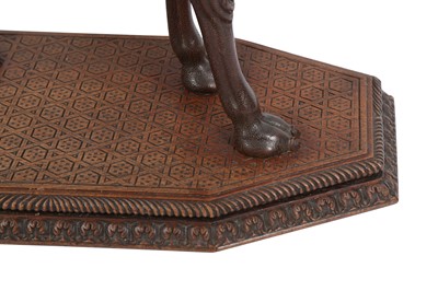 Lot 871 - AN ANGLO-INDIAN CARVED HARDWOOD OCCASIONAL CAMEL TABLE