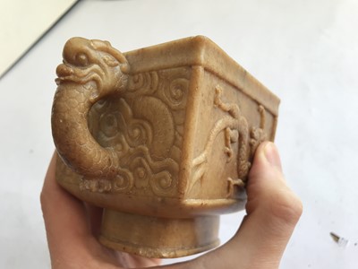 Lot 54 - A CHINESE SOAPSTONE ARCHAISTIC 'DRAGON' POURING VESSEL.