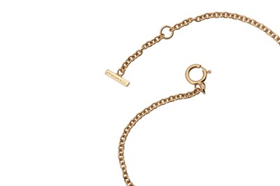 Lot 1264 - Tiffany & Co. | A gold 'Tiffany T Smile' bracelet