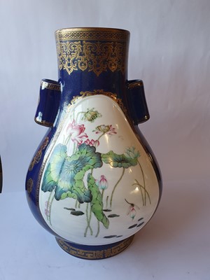 Lot 9 - A CHINESE FAMILLE ROSE POWDER-BLUE GROUND ARROW VASE.