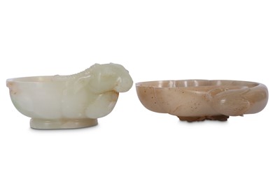 Lot 674 - TWO CHINESE JADE WASHERS.