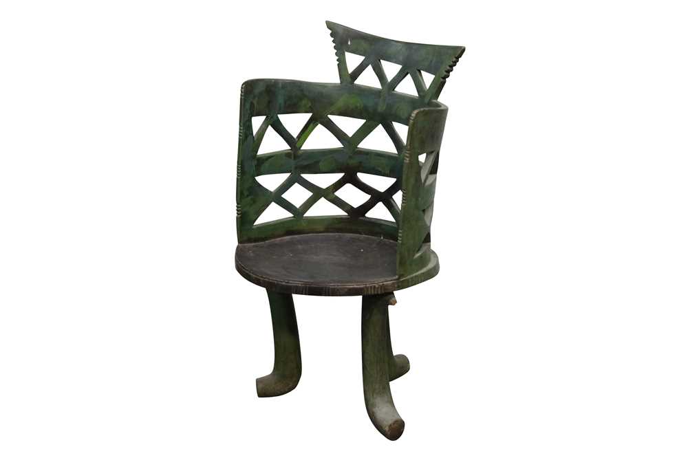Lot 683 - A 20th century African hardwood and green stain pierced barrel form chair