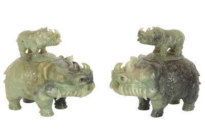 Lot 368 - A pair of Chinese green hardstone rhinoceros form incense burners, late 20th century