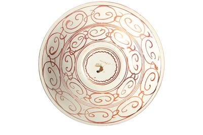 Lot 936 - A RUBY COPPER-LUSTRE POTTERY CHARGER