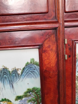 Lot 129 - A CHINESE FAMILLE ROSE BURLWOOD FOUR-FOLD SCREEN.