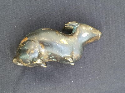 Lot 225 - A CHINESE GOLD-SPLASHED SILVER AND BRONZE INLAID BRONZE 'RAT' PAPERWEIGHT.