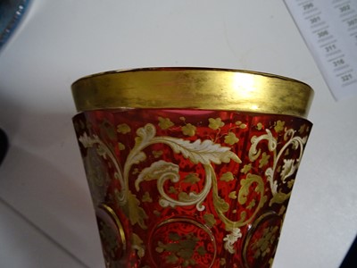 Lot 82 - A late19th century Bohemian ruby and gilt glass goblet and cover