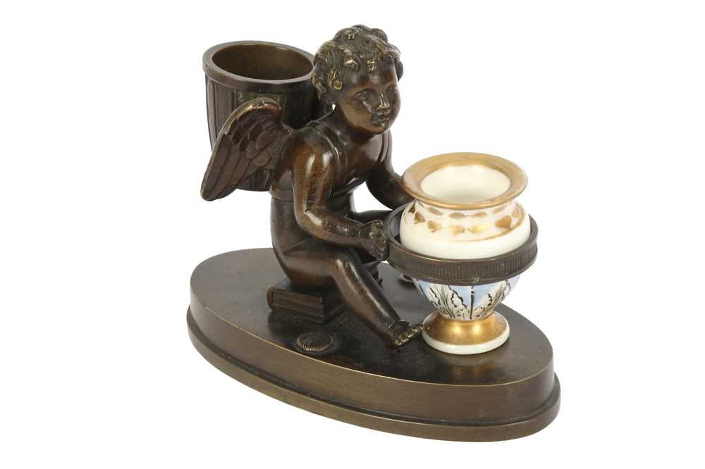 Lot 171 - A PATINATED BRONZE ENCRIER IN THE FORM OF A SEATED WINGED CHERUB, 19TH CENTURY