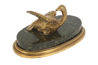 Lot 411 - A 19th century gilt bronze and serpentine marble paper weight