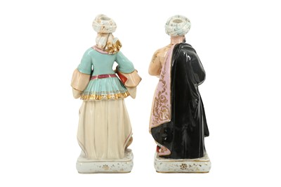 Lot 949 - A PAIR OF FRENCH POLYCHROME-PAINTED PORCELAIN FIGURAL SCENT BOTTLES