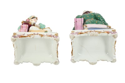 Lot 951 - A PAIR OF FRENCH POLYCHROME-PAINTED PORCELAIN FIGURAL SCENT BOTTLES