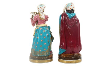 Lot 948 - A PAIR OF FRENCH POLYCHROME-PAINTED PORCELAIN FIGURAL SCENT BOTTLES