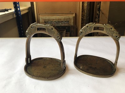 Lot 504 - A PAIR OF CHINESE BRONZE STIRRUPS.