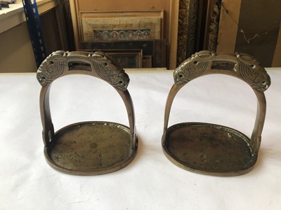 Lot 504 - A PAIR OF CHINESE BRONZE STIRRUPS.