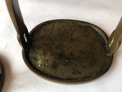 Lot 504 - A PAIR OF CHINESE BRONZE STIRRUPS.