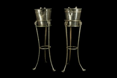 Lot 65 - A PAIR OF 20TH CENTURY SILVERED METAL CHAMPAGNE BUCKETS ON STANDS