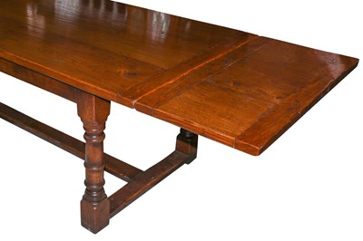 Lot 686 - A 17th century style oak extending refectory dining table