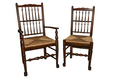 Lot 695 - A set of eight oak vernacular Lancashire spindle back dining chairs