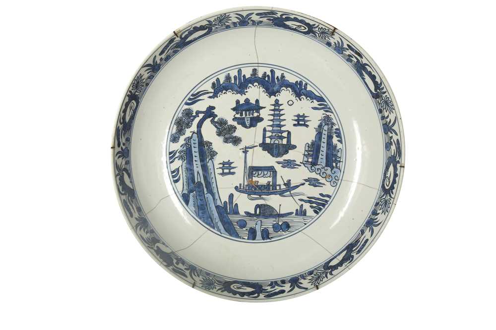 Lot 942 - A LARGE CHINESE-REVIVAL BLUE AND WHITE POTTERY CHARGER