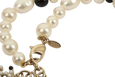 Lot 1207 - Chanel Pearl and Black Bead Necklace