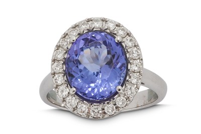 Lot 1301 - A tanzanite and diamond cluster ring