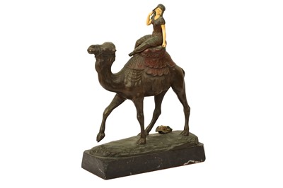 Lot 866 - λ AN EARLY 20TH CENTURY PATINATED AND COLD PAINTED BRONZE ORIENTALIST FIGURE