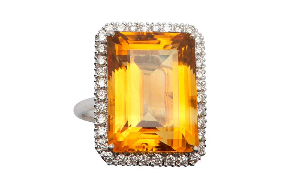 Lot 1219 - A citrine and diamond cluster ring