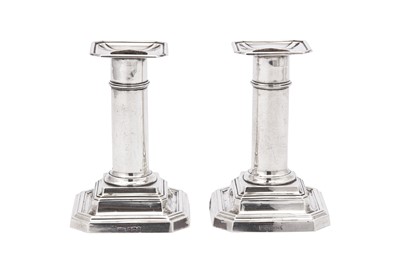 Lot 251 - A pair of George V sterling silver dwarf or desk candlesticks, Sheffield 1911 by James Dixon and Sons