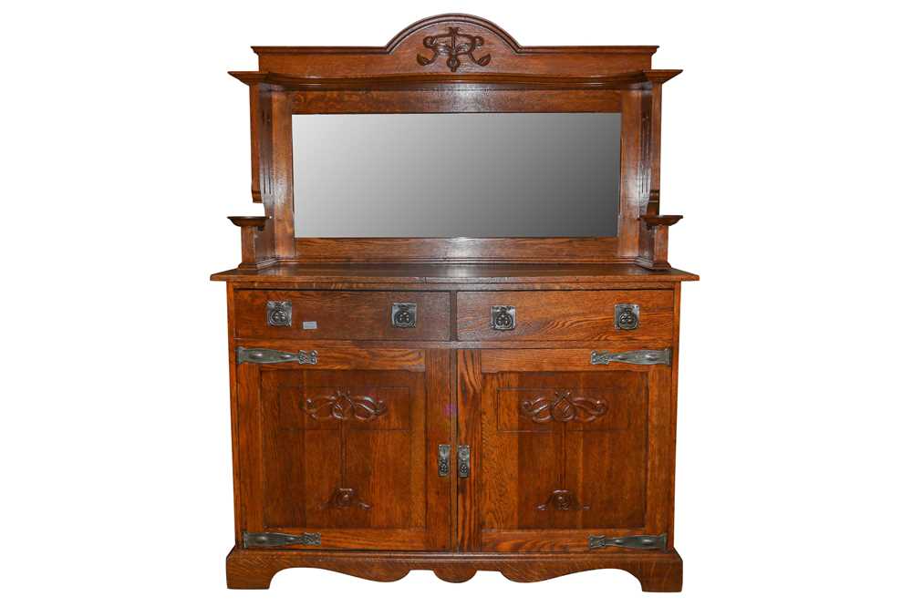 Lot 712 - An Arts and Crafts oak sideboard