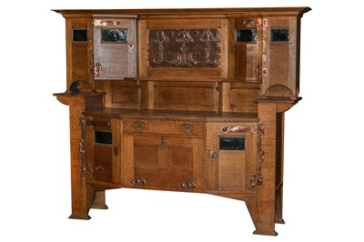 Lot 697 - A large Arts and Crafts oak dresser, attributed Shapland and Petter