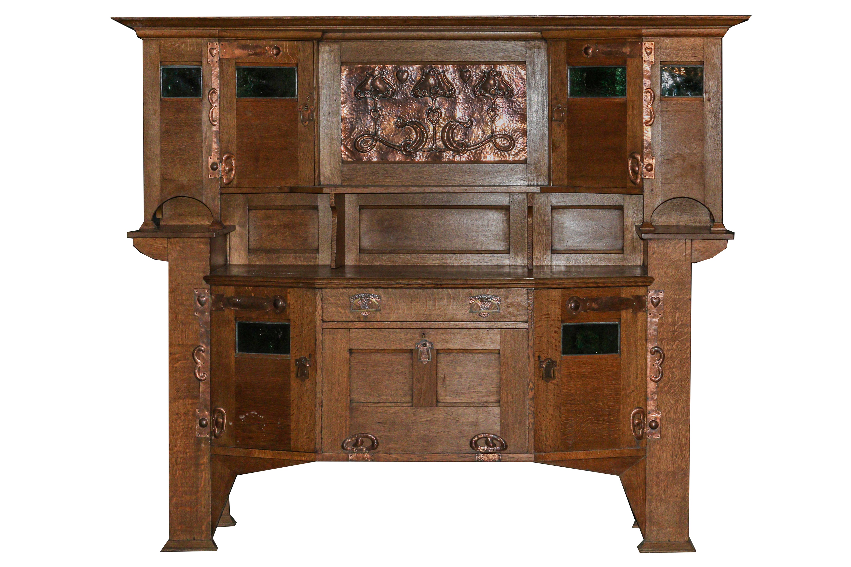 Lot 697 A large Arts and Crafts oak dresser,