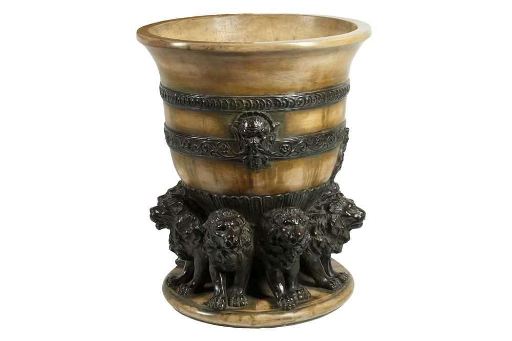 Lot 157 - AN EARLY 20TH CENTURY ITALIAN TERRACOTTA JARDINIERE DECORATED WITH LIONS