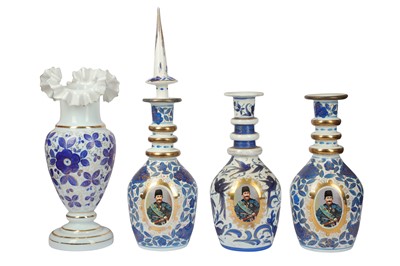 Lot 92 - A set of three 20th century glass and enamelled Islamic taste decanters
