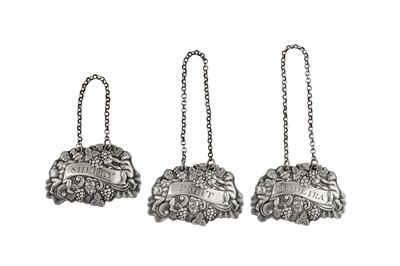 Lot 130 - A set of George III sterling silver wine labels, Sheffield 1809 by Robert Gainsford