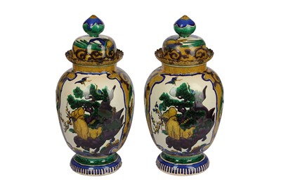 Lot 102 - A pair of late 19th/early 20th century Sancai style pottery vases and covers