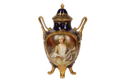 Lot 46 - A late 19th/early 20th century Vienna style porcelain twin handled urn and cover