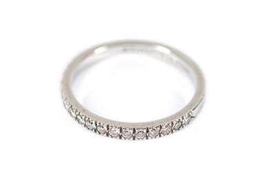 Lot 227 - A Tiffany and Co platinum and diamond half hoop eternity ring