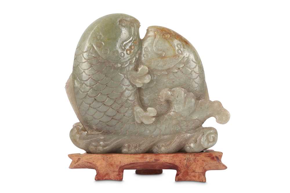 Lot 706 - A CHINESE PALE CELADON JADE 'DOUBLE FISH' CARVING.