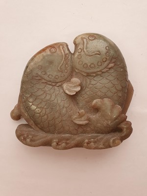 Lot 706 - A CHINESE PALE CELADON JADE 'DOUBLE FISH' CARVING.