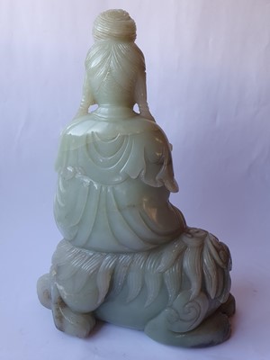 Lot 261 - A LARGE CHINESE PALE CELADON JADE FIGURE OF GUANYIN.