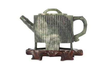 Lot 539 - A CHINESE GREEN JADE TEAPOT AND COVER.