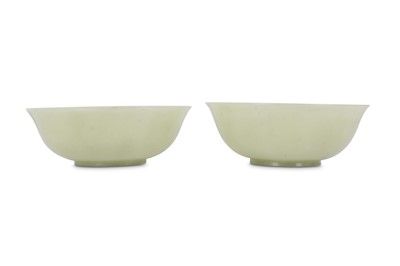 Lot 564 - A PAIR OF CHINESE PALE CELADON JADE BOWLS.