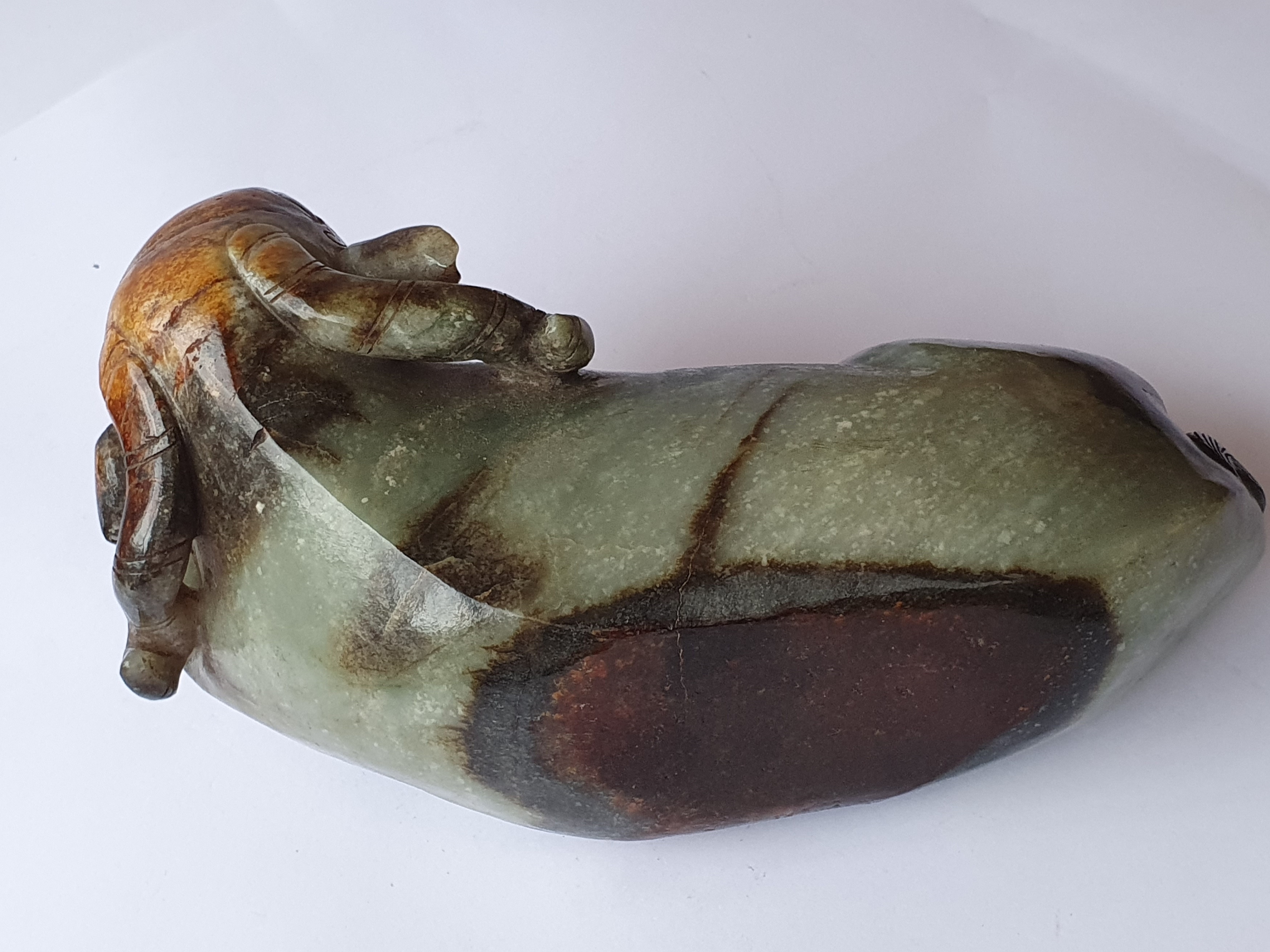 Lot 394 - A CHINESE PALE CELADON JADE 'RAM' CARVING.