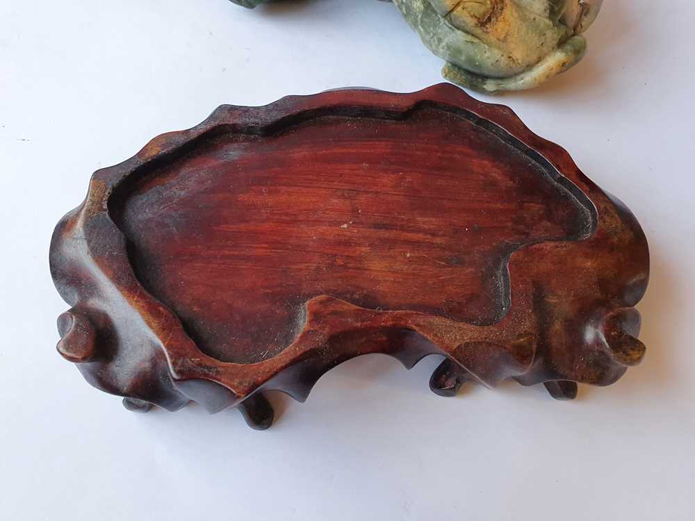 Lot 396 A CHINESE PALE CELADON JADE 'OX' CARVING.