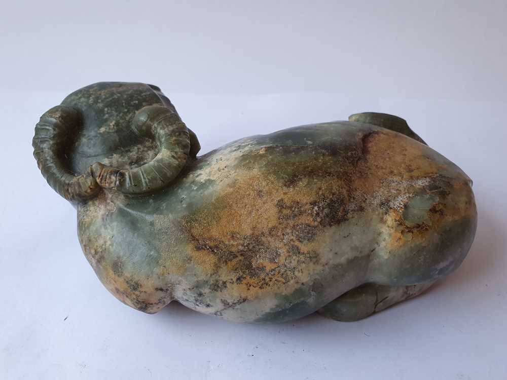 Lot 396 A CHINESE PALE CELADON JADE 'OX' CARVING.