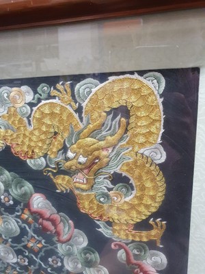 Lot 276 - A CHINESE SQUARE BLACK-GROND EMBROIDERED SILK 'DRAGON' PANEL.