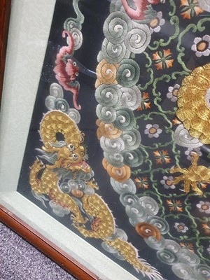 Lot 276 - A CHINESE SQUARE BLACK-GROND EMBROIDERED SILK 'DRAGON' PANEL.