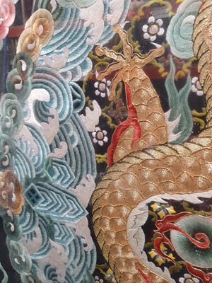 Lot 104 - A CHINESE RECTANGULAR BLACK-GROUND EMBROIDERED SILK 'DRAGON' PANEL.